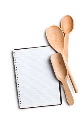 blank recipe book with kitchen utensils