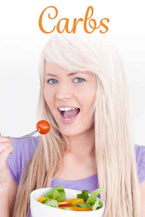 The word carbs against gorgeous smiling woman eating her salad